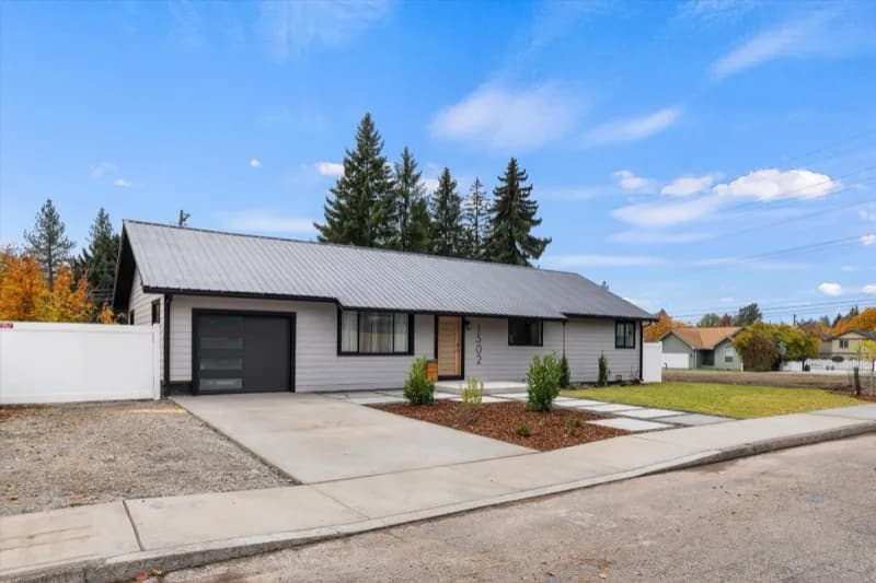 Modern farmhouse with wood and dark siding