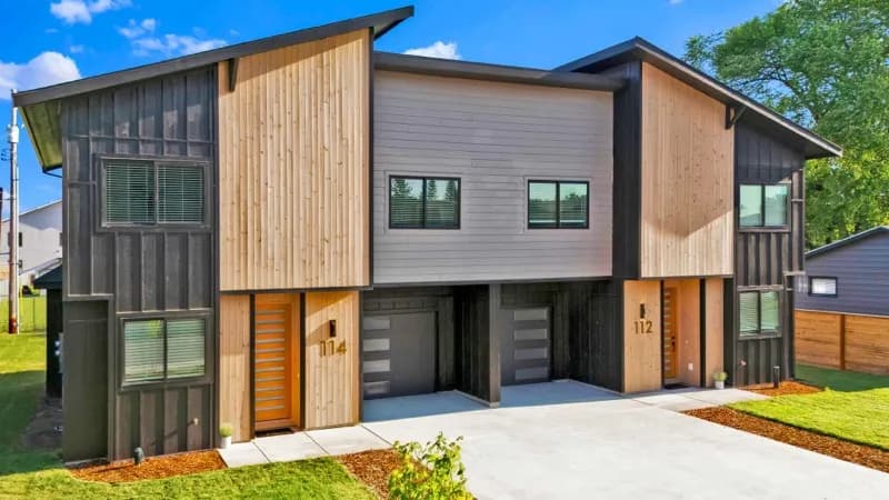 Modern duplex with wood and metal siding
