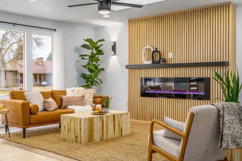 Living room with wood slat accent wall and electric fireplace