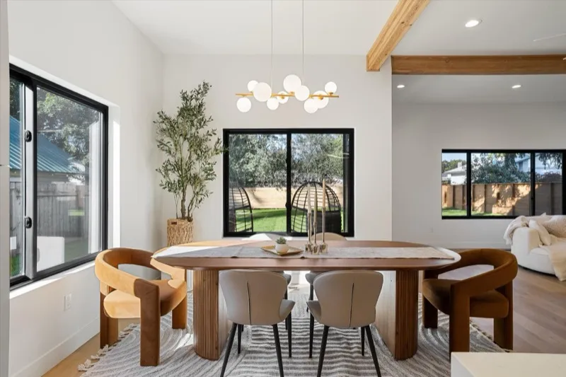 Dining room with bubble chandelier and exposed beam