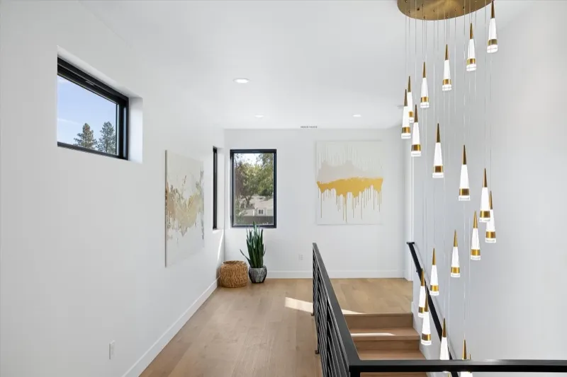 Stairway with cascading pendant light installation
